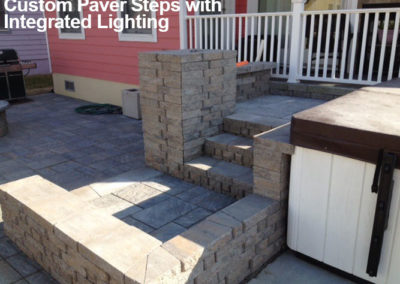 Custom paver steps with integrated lighting by Browder-Hite